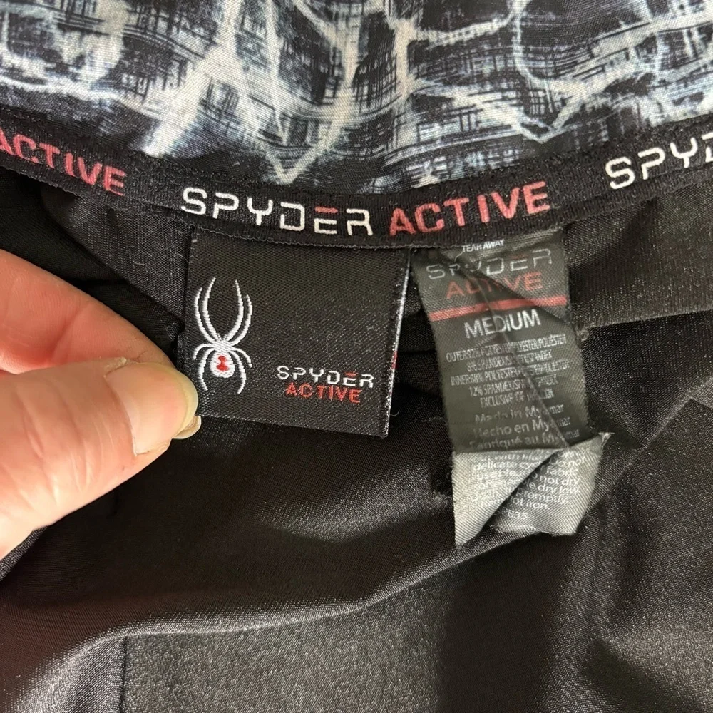 Spyder Black and White Running Jacket with layered Athletic Silhouette